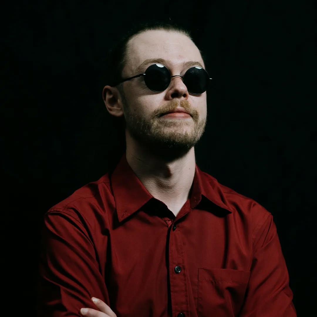 Band member in red shirt